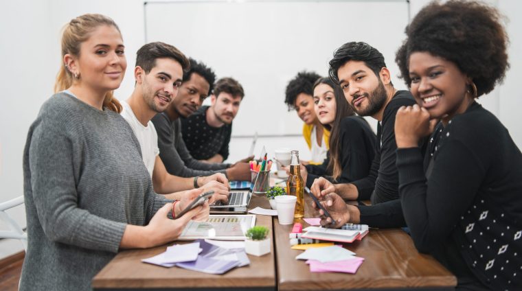Group of multiethnic creative business people working on a project and having a brainstorming meeting. Team work and brainstorming concept.